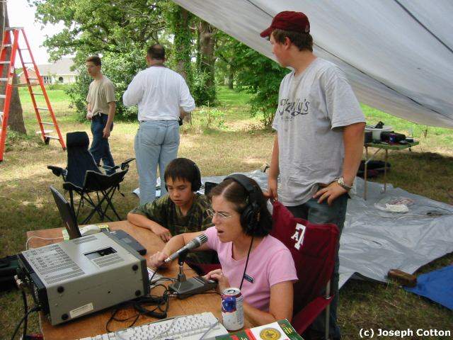 Visitors listen in - KD5USF, KD5NPF, N5MSH (at the microphone)